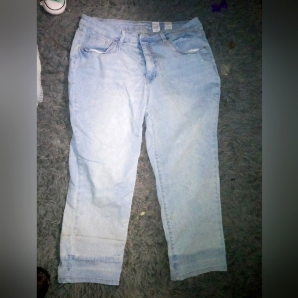 Two pairs of light colored jeans one pair is boyfriend jeans and other is skinny